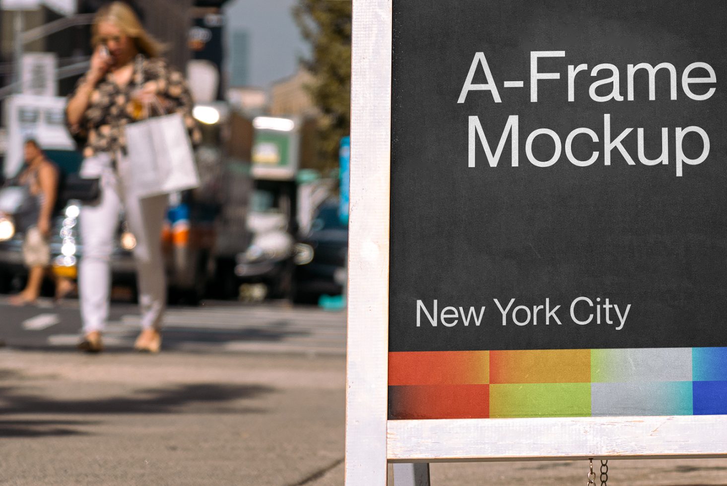 Urban A-Frame signboard mockup on a busy street with blurred background, ideal for designers to display signage or advertising graphics.